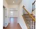 Bright entryway featuring hardwood floors, staircase, and a view into the spacious rooms beyond at 251 Winford Rd, Troutman, NC 28116