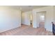 Bright carpeted hallway with an open view to a bathroom and an adjacent room at 251 Winford Rd, Troutman, NC 28116