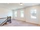 Spacious carpeted hallway with natural light streaming through three large windows at 251 Winford Rd, Troutman, NC 28116