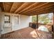 Wooden back deck with lattice railings and yard access at 317 W Main St, Marshville, NC 28103