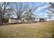 Large backyard with two sheds and mature trees at 317 W Main St, Marshville, NC 28103