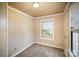 Simple bedroom with wood paneling and two windows at 317 W Main St, Marshville, NC 28103