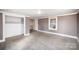 Bright bedroom featuring neutral walls and carpet at 317 W Main St, Marshville, NC 28103