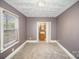 Simple bedroom with carpet, neutral walls, and ensuite bathroom at 317 W Main St, Marshville, NC 28103