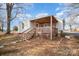 Single story home with wooden deck and yard at 317 W Main St, Marshville, NC 28103