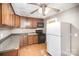 Cozy kitchen featuring wood cabinets, tile floor and appliances at 317 W Main St, Marshville, NC 28103