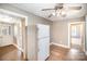 Kitchen with a view into another room, refrigerator, and tiled floor at 317 W Main St, Marshville, NC 28103