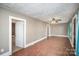 Living room with hardwood floors and access to bedroom at 317 W Main St, Marshville, NC 28103