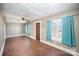 Living room with hardwood floors and teal curtains at 317 W Main St, Marshville, NC 28103