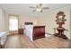 Well-lit bedroom featuring hardwood floors and classic furniture at 335 Ridgewood Dr, Mt Ulla, NC 28125