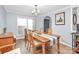 A brightly lit dining area showcasing a wooden table with seating for six and wood floors at 335 Ridgewood Dr, Mt Ulla, NC 28125