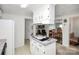 A kitchen island cooktop with white cabinetry, modern appliances, and an open layout at 335 Ridgewood Dr, Mt Ulla, NC 28125