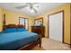 Bedroom with a wooden bed frame, dresser and carpet flooring at 352 Leafmore Dr, Charlotte, NC 28213