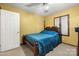 Bedroom with a wooden bed frame, dresser and carpet flooring at 352 Leafmore Dr, Charlotte, NC 28213