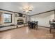 Bright dining area with tile floors, fireplace, and built-in seating at 352 Leafmore Dr, Charlotte, NC 28213