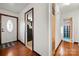 Hardwood floor entryway with a view of the kitchen and bathroom at 352 Leafmore Dr, Charlotte, NC 28213