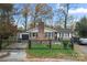 Brick ranch home with a fenced yard and attached garage at 352 Leafmore Dr, Charlotte, NC 28213