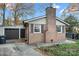 Brick home with an attached garage and a large yard at 352 Leafmore Dr, Charlotte, NC 28213