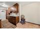 Kitchen with dark wood cabinets and granite countertops at 352 Leafmore Dr, Charlotte, NC 28213