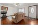 Living room with hardwood floors, a couch, and a TV at 352 Leafmore Dr, Charlotte, NC 28213