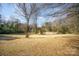 Large backyard with mature trees and open lawn area at 109 Stonecrest Sw Cir, Concord, NC 28027