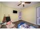 Well-lit bedroom with a TV mount, hardwood floors, and a bed at 109 Stonecrest Sw Cir, Concord, NC 28027