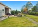 Landscaped backyard with patio, fire pit and play area at 1419 Imperial Court Imperial Ct, York, SC 29745