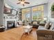 Spacious living room with fireplace, hardwood floors, and large windows at 1419 Imperial Court Imperial Ct, York, SC 29745