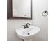 A half-bathroom with a stylish mirror and sink at 14922 Deshler Ct, Charlotte, NC 28273