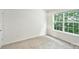 A bedroom with carpet flooring and a window with natural light at 14922 Deshler Ct, Charlotte, NC 28273