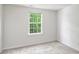 Cozy bedroom with a window showing a private, wooded view at 14922 Deshler Ct, Charlotte, NC 28273