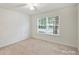 An empty bedroom filled with natural light coming from the windows at 14922 Deshler Ct, Charlotte, NC 28273
