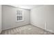 Simple bedroom with carpet and window at 14922 Deshler Ct, Charlotte, NC 28273