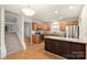 Well-equipped kitchen with island, stainless steel appliances, wooden cabinets, and adjacent staircase to the second floor at 14922 Deshler Ct, Charlotte, NC 28273