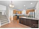 Kitchen with island, stainless steel appliances, and access to stairs at 14922 Deshler Ct, Charlotte, NC 28273
