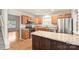 Efficient kitchen with wooden cabinets, stainless steel appliances, and a center island offering additional counter space at 14922 Deshler Ct, Charlotte, NC 28273