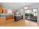 Kitchen features an island and sliding glass doors to patio at 14922 Deshler Ct, Charlotte, NC 28273