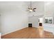 Bright living room with vaulted ceiling, fireplace, and wood floors, providing a comfortable and spacious area at 14922 Deshler Ct, Charlotte, NC 28273