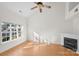 Bright living room with hardwood floors and a fireplace at 14922 Deshler Ct, Charlotte, NC 28273