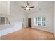 Inviting living room with hardwood floors, staircase, and large window allowing natural light to fill the space at 14922 Deshler Ct, Charlotte, NC 28273