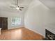 Bright living room with hardwood floors, fireplace, and large windows, perfect for entertaining guests or relaxing at 14922 Deshler Ct, Charlotte, NC 28273