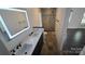 Modern bathroom with double vanity, sleek fixtures, and tiled walk-in shower at 16425 Grapperhall Dr, Huntersville, NC 28078