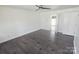 Spacious bedroom with dark floors, neutral walls and ceiling fan at 16425 Grapperhall Dr, Huntersville, NC 28078