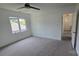 Bedroom with carpeting and multiple windows for ample natural light at 16425 Grapperhall Dr, Huntersville, NC 28078