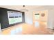 Spacious dining room with hardwood floors and three large windows for ample light at 16425 Grapperhall Dr, Huntersville, NC 28078