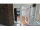 Inviting entryway features wood floors, white trim, and glass paneled doors leading to kitchen at 16425 Grapperhall Dr, Huntersville, NC 28078