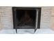 Painted brick fireplace with glass doors and a traditional hearth, adding cozy charm at 16425 Grapperhall Dr, Huntersville, NC 28078