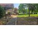 Manicured lawn and brick accents with a walkway to a charming home at 16425 Grapperhall Dr, Huntersville, NC 28078
