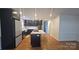 Modern kitchen with dark cabinetry, stainless steel appliances, and a center island at 16425 Grapperhall Dr, Huntersville, NC 28078