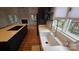 Close-up of a modern kitchen sink with quartz countertops and sleek cabinetry at 16425 Grapperhall Dr, Huntersville, NC 28078